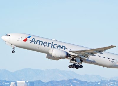 American Airlines Boeing 777-223(ER) aircraft is airborne as it departs Los Angeles International Airport. Los Angeles, California USA
