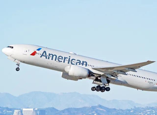 American Airlines Boeing 777-223(ER) aircraft is airborne as it departs Los Angeles International Airport. Los Angeles, California USA