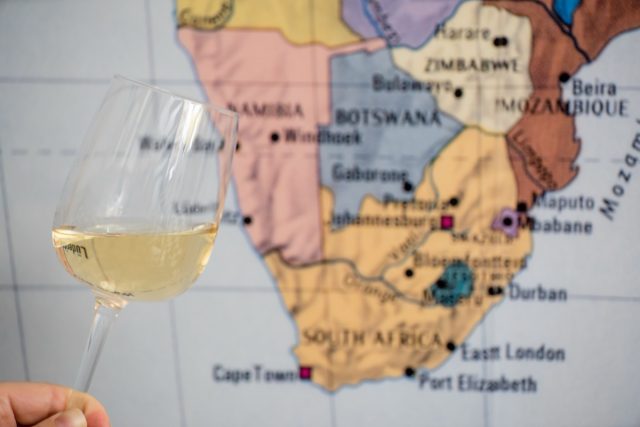 glass of wine near map
