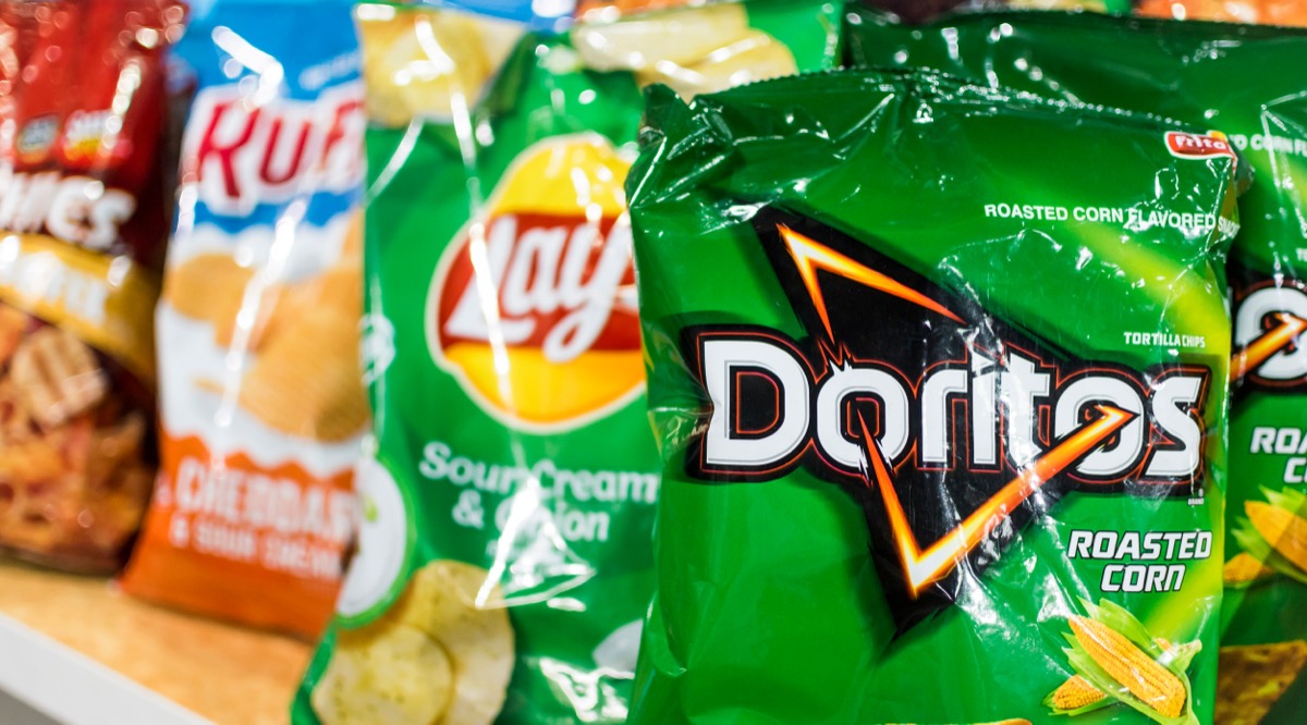 Manila, Philippines - Dec 2020: A row of popular Frito Lay Brands at a supermarket.