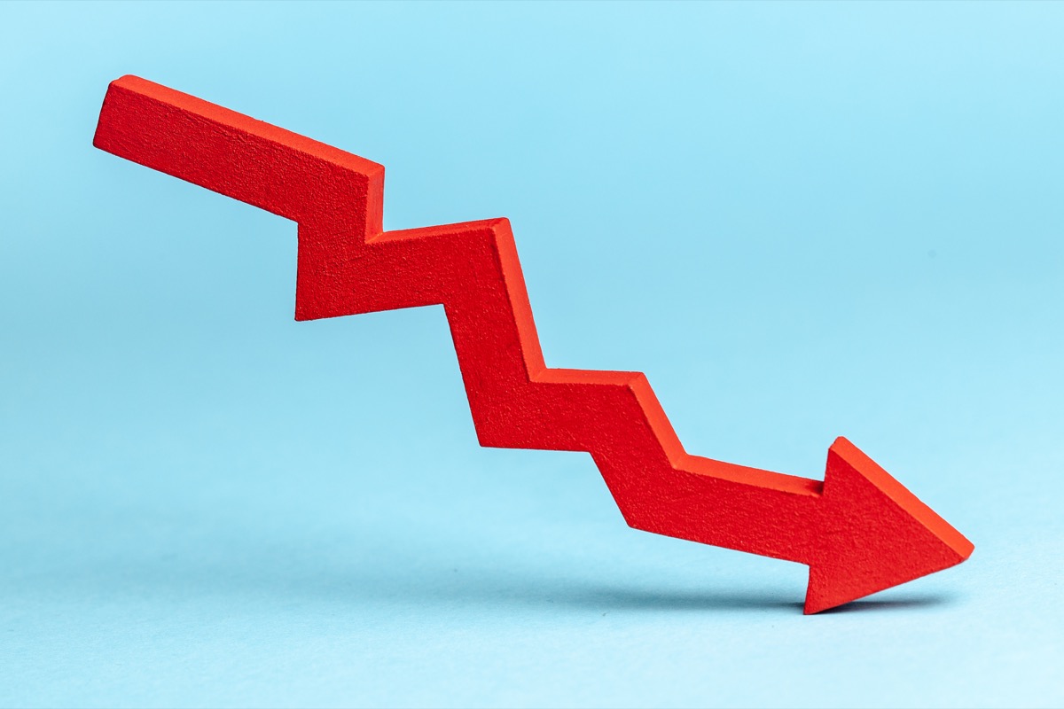 Chart,With,Red,Down,Arrow,On,Blue,Background.,Falling,Growth