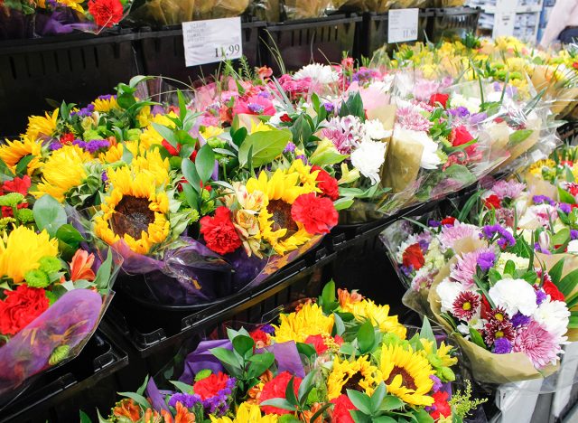 A view of the floral section of a local Costco, featuring an array of beautiful flower bouquets on display.