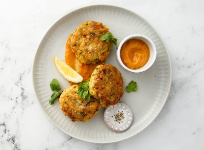 Traditional homemade fish cakes with tomato sauce