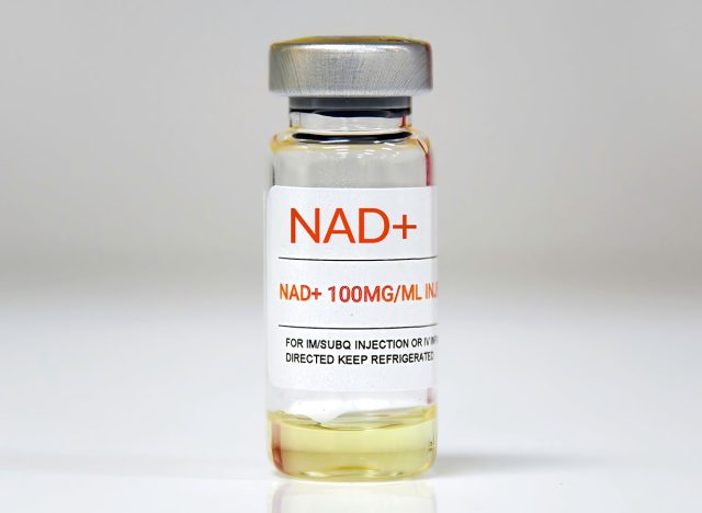 A single vial of NAD + on white background.