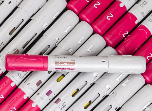 Humira injection pens displayed in an organized manner, showcasing their detailed and standardized design in vibrant red and white hues. Ideal for medical or pharmaceutical-related contexts.