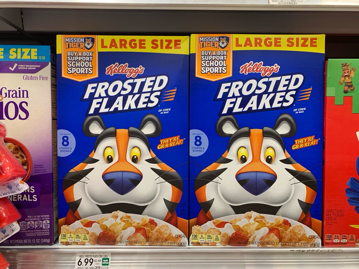Boca Raton, FL USA - July 21, 2024: Large size of Kellogg's frosted flakes cereal on a shelf in Publix supermarket with Tony the Tiger on the cover.