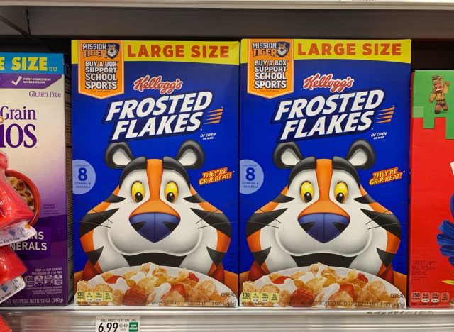 Boca Raton, FL USA - July 21, 2024: Large size of Kellogg's frosted flakes cereal on a shelf in Publix supermarket with Tony the Tiger on the cover.