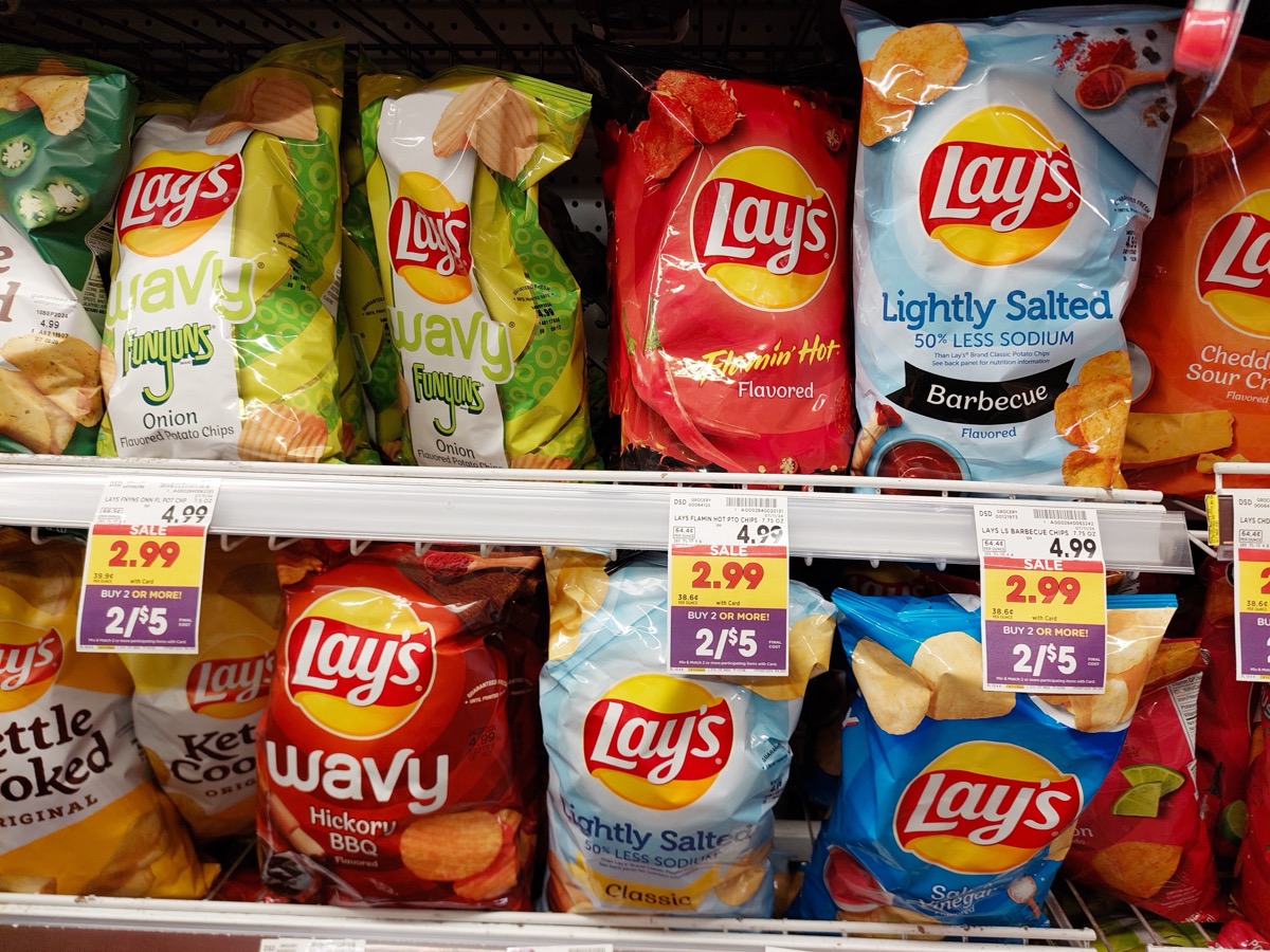 Los Angeles, California – July 21, 2024: bags of different flavors of LAY'S on a shelf in a supermarket