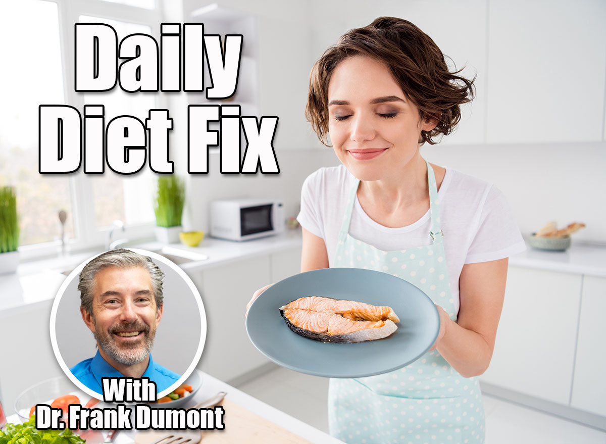 Dr. Frank Dumont. Here's What Happens to Belly Fat When You Eat 100g Protein Daily After 50. Cover. Photo of housewife lady chef hold ready grilled salmon trout fillet steak need garnish cook dinner one person portion eyes closed enjoy smell wear apron modern kitchen indoors