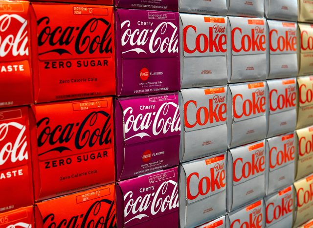 Boxes with different kinds of Coca-Cola, selective focus. Classic, zero sugar, cherry, diet Coca-Cola. Everett, WA, USA - October 2022
