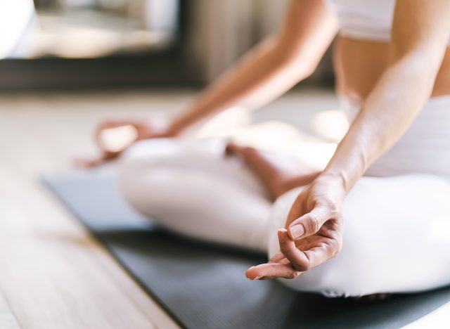 Easy Seat pose Female Attractive asian woman doing yoga stretching exercise on mat yoga fitness exercises. Healthy lifestyle Calmness and relax at home