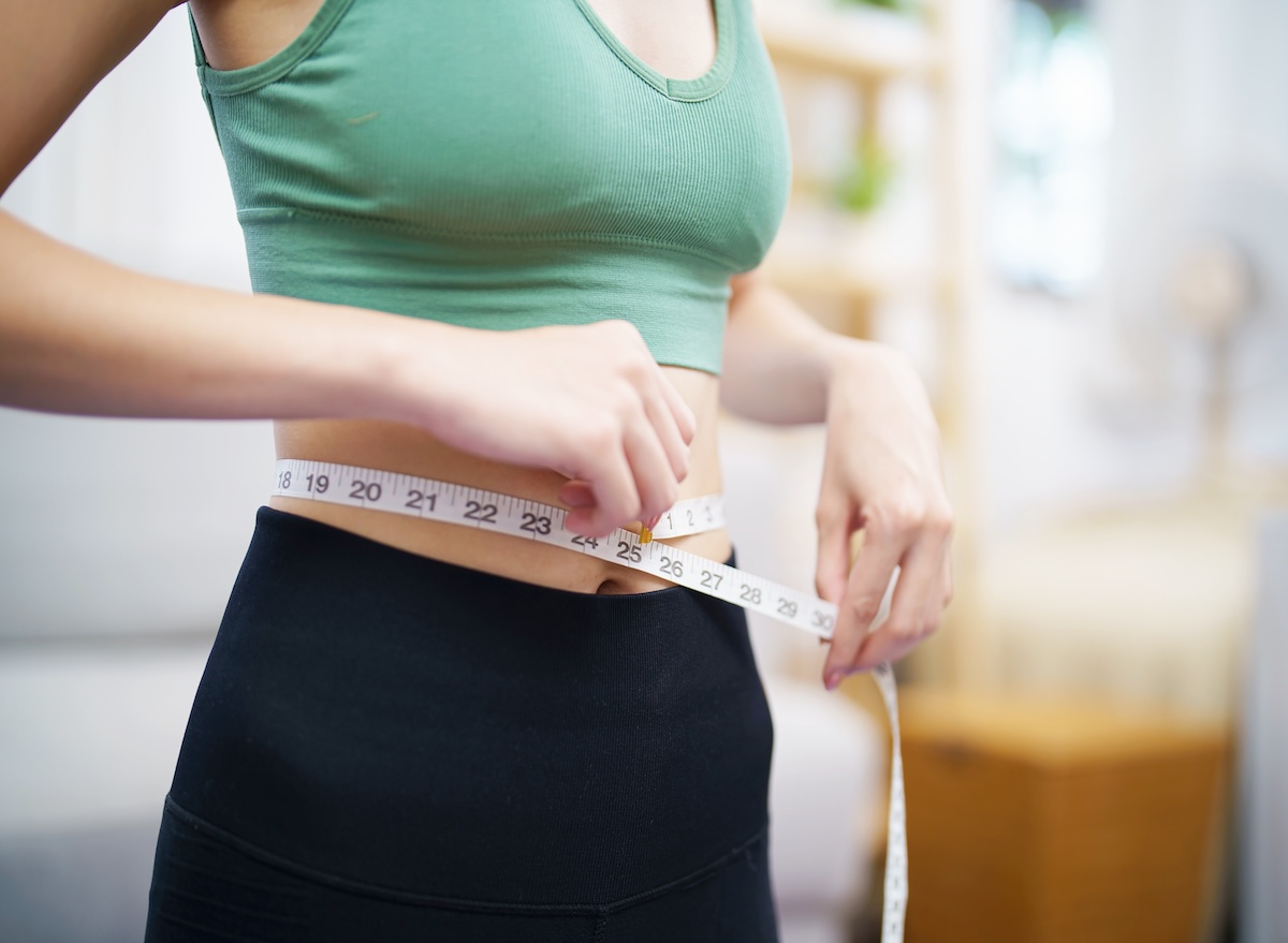 Asian,Healthy,Woman,Dieting,Weight,Loss.,Slim,Woman,Measuring,Waist