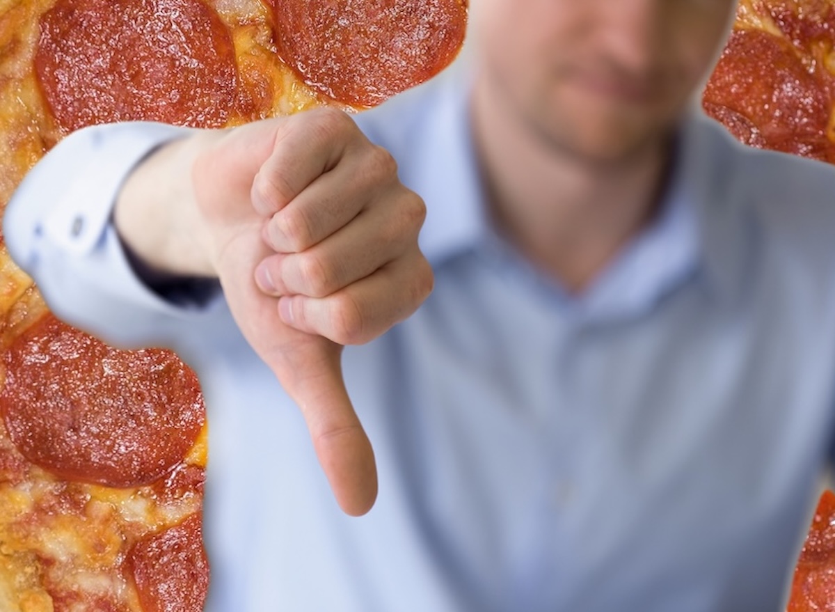 Pepperoni,Pizza,Up,Close,Studio,Shot,Against,A,Wooden,Background