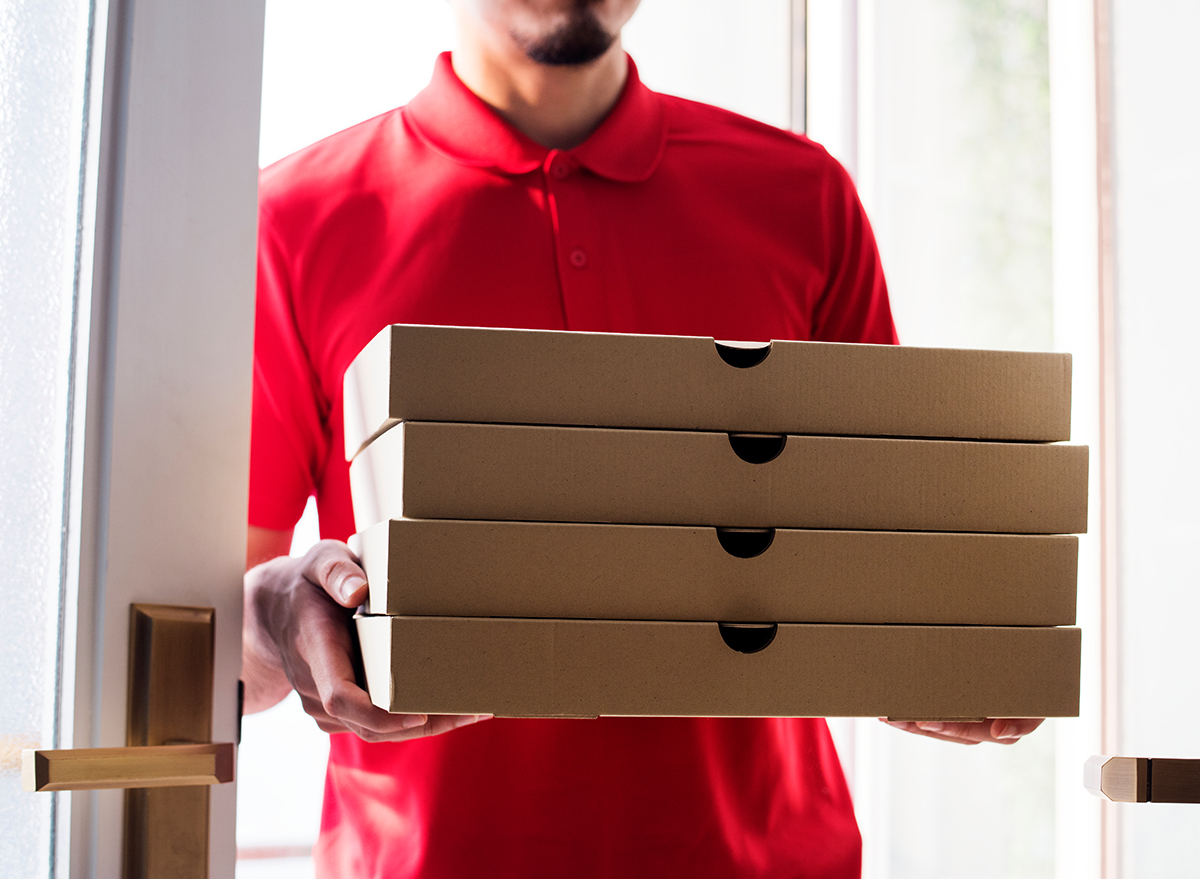 Man delivery pizza to customer