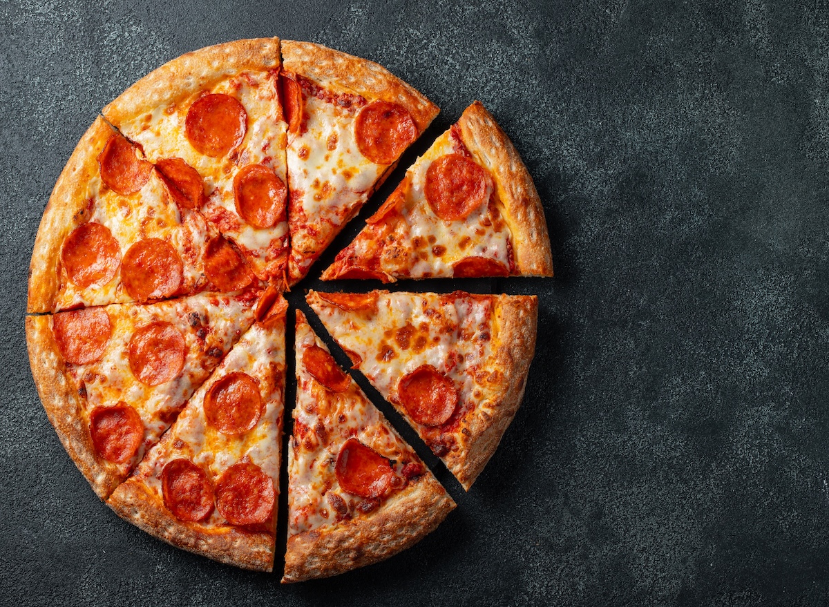 Tasty,Pepperoni,Pizza,And,Cooking,Ingredients,Tomatoes,Basil,On,Black