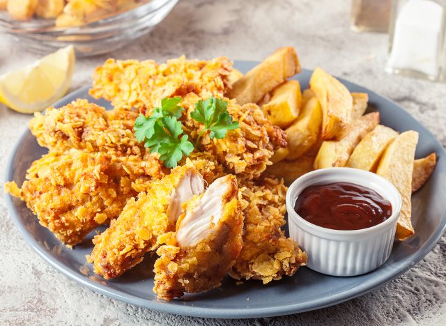 Chicken strips in cornflakes breadcrumb served with french fries