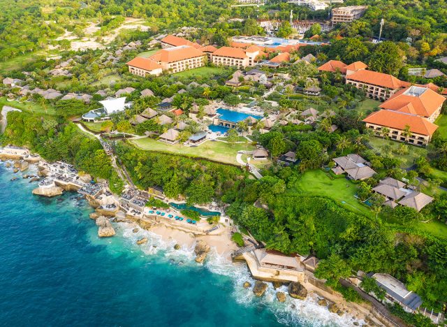 Bali, Indonesia - December 26 2020: Aerial view of the Ayana Resort which is famous for its Rock bar at the bottom of an impressive cliff in Bali, Indonesia.