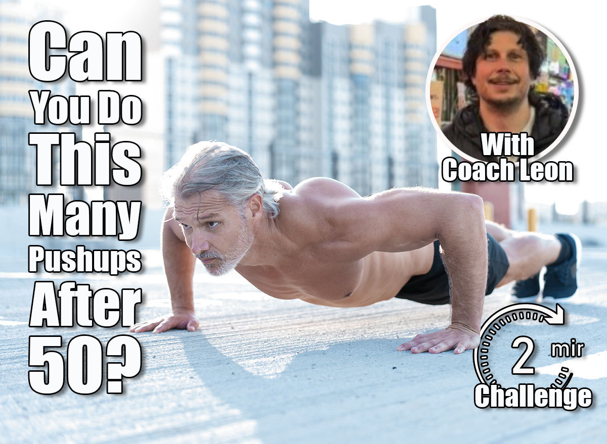 Middle-aged athletic man doing push ups outdoors. Fitness and exercising outdoors urban environment.