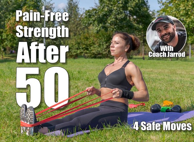 Muscular middle aged caucasian woman does seated row exercise for latissimus dorsi muscles using resistance band in city park on green grass. Black sportswear. Healthy lifestyle. Outdoor sport theme. 4 Pain-Free Exercises That Build Muscle Without Stress After 50, Say Experts. Cover