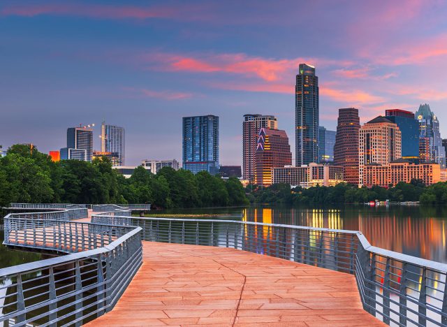 Austin, Texas, USA downtown skyline over the Colorado River at dawn.