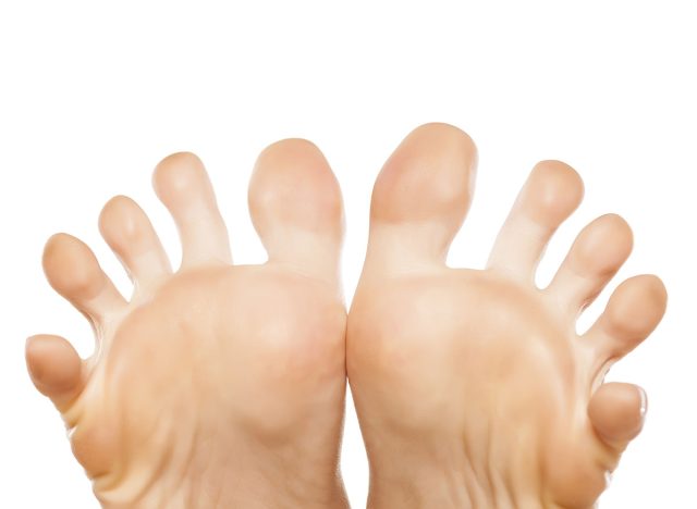 spread toes on the nice ladies' foot