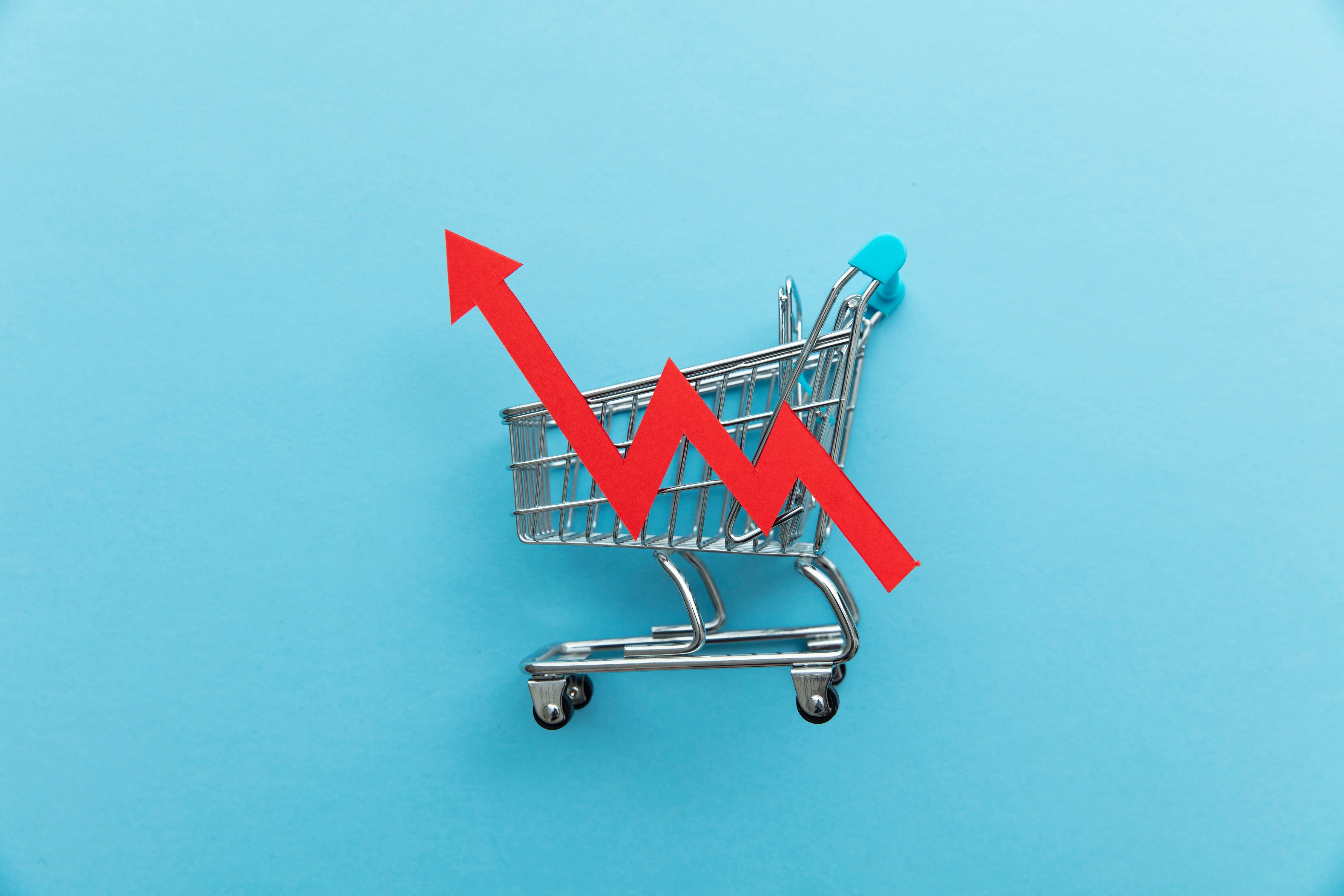 Rising,Cost,Of,Shopping.,Shopping,Cart,With,Red,Inflation,Arrow