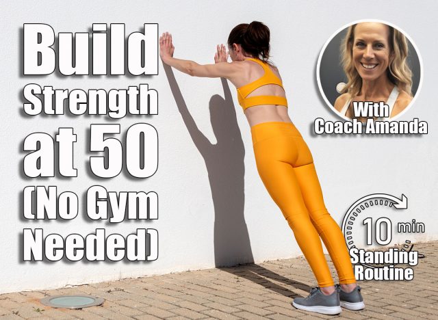 Sporty woman doing push off exercises against a wall. This 10-Minute Standing Routine Builds More Strength Than Gym Workouts After 50. Cover