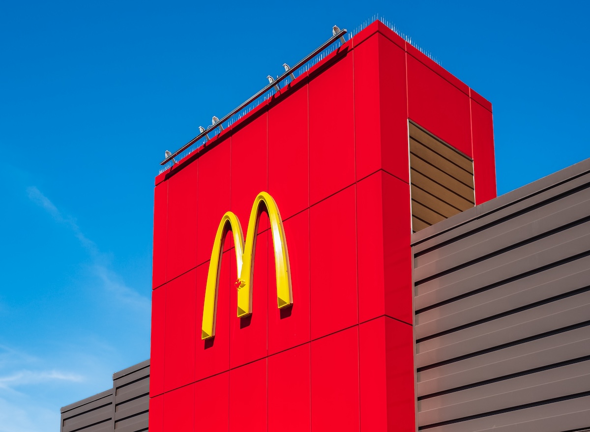 Mcdonald’s,Popular,Golden,Arches,On,A,Red,Outdoor,Signboard,Blue