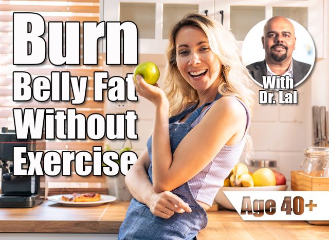 Caucasian young woman holding an apple on hands in the kitchen at home. Attractive beautiful girl wearing apron feeling happy and relax, enjoy cooking healthy fruit for lose weight and diet in house. 4 Simple Changes That Burn Belly Fat Without Exercise After 40. Cover