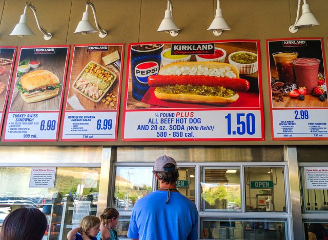 Customers wait at a Costco food court for its famous $1.5 hot-dog-and-soda combo.