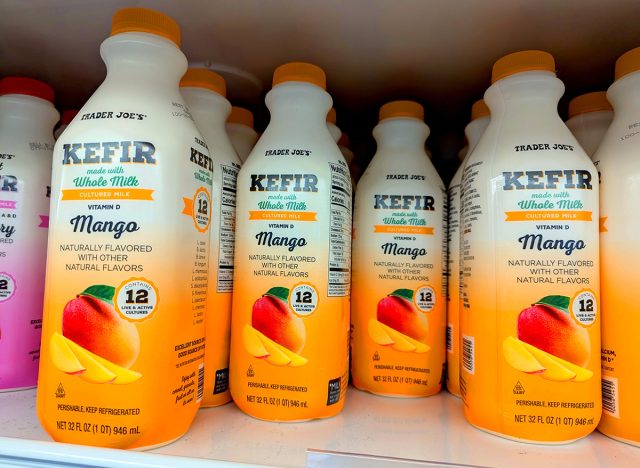Bottles of Trader Joe's Kefir Fermented Dairy Product Mango Flavor on Shelf