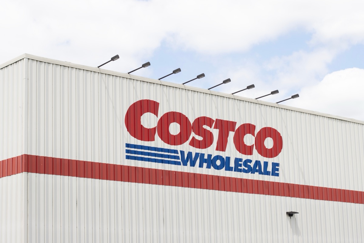 Tigard, OR, USA - May 17, 2022: Costco sign is seen at its store in Tigard, Oregon. Costco Wholesale Corporation operates a chain of membership-only warehouse club retail stores.