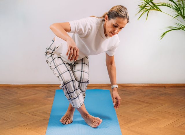 Woman Doing Sitting and Rising Test at Home