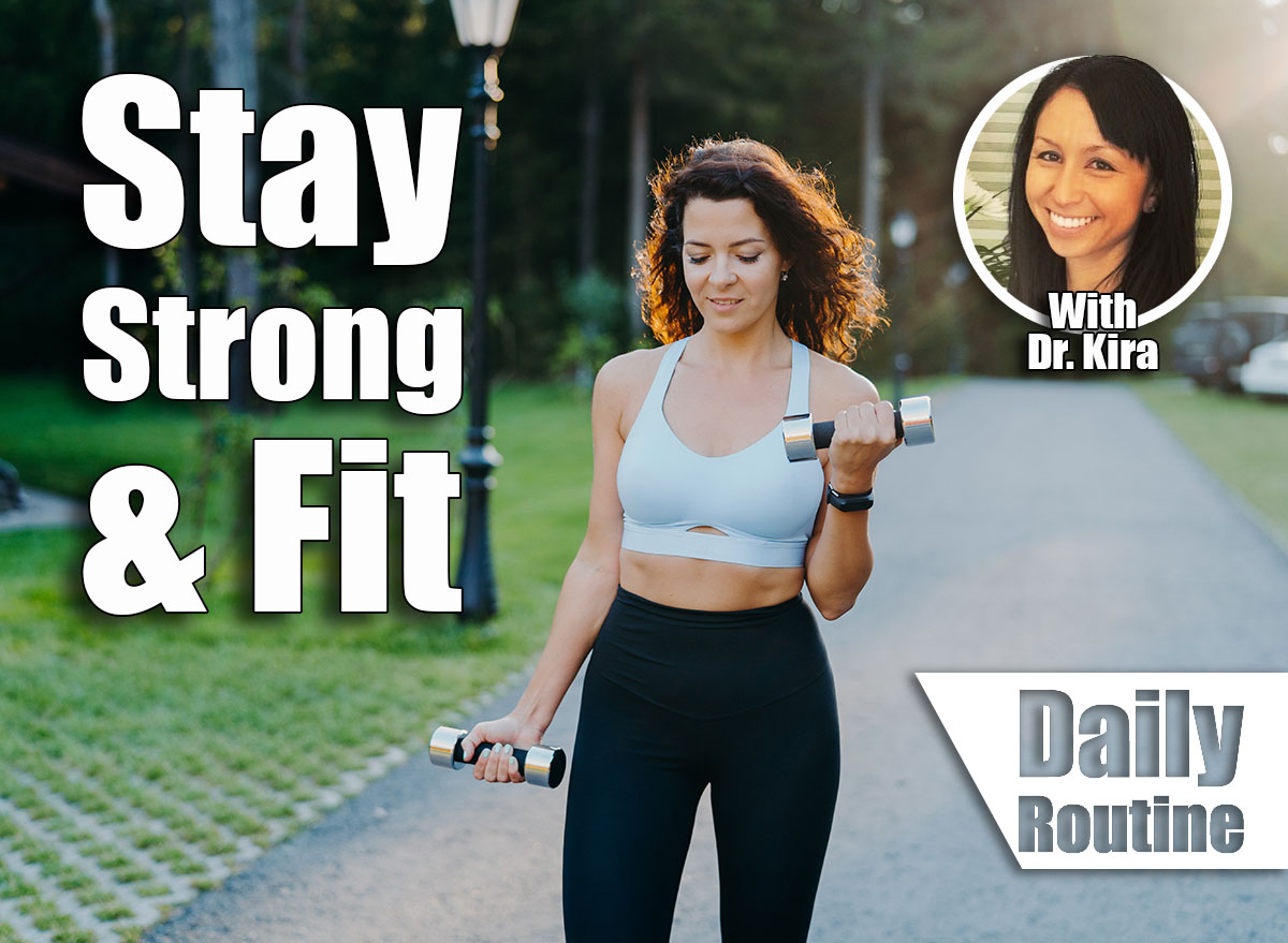 Outdoor shot of motivated brunette young woman wears cropped bra and leggings, has slim perfect figure, raises dumbbells and trains biceps, has workout in open air. Fitness exercising concept. Is Walking Enough To Stay Strong & Fit After 50? Cover