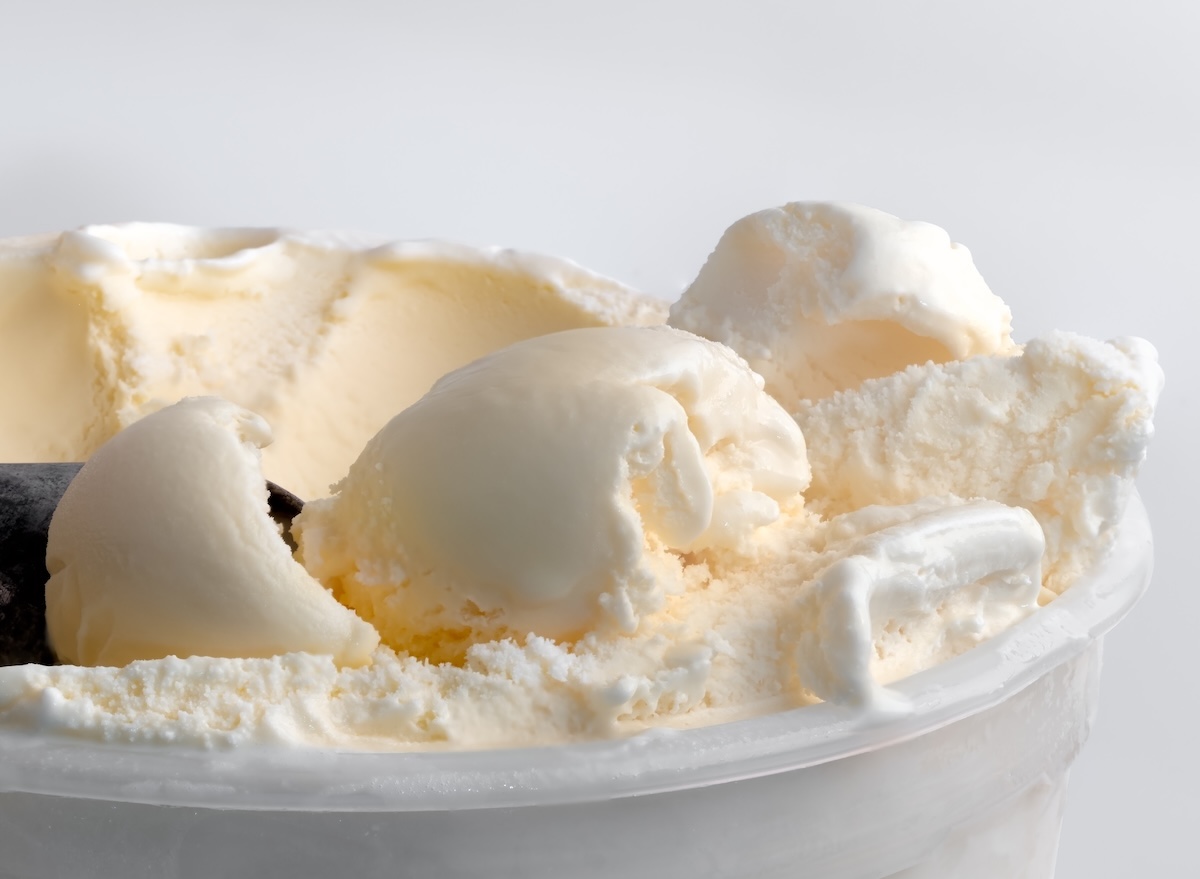 Scoops,Of,Vanilla,Ice,Cream,On,Top,Of,A,Tub