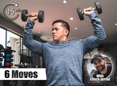 A health conscious man in his early 40s doing seated dumbbell presses. Maintaining a healthy physique in middle age. 6 Standing Moves That Build Strength Without Getting on the Floor After 50. Cover