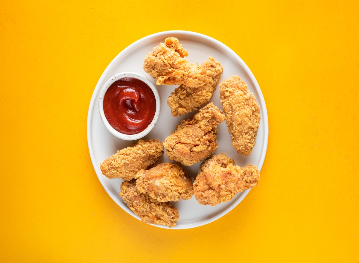Deep,Fried,Chicken,Wings,On,Plate,Isolated,On,Yellow,Background