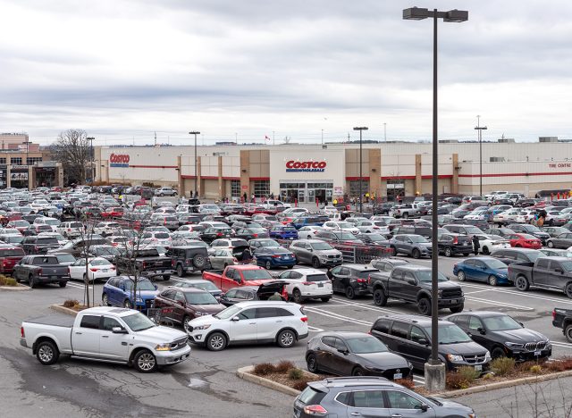 Parking lot full of cars near Costco Wholesale warehouse store on a busy shopping Saturday