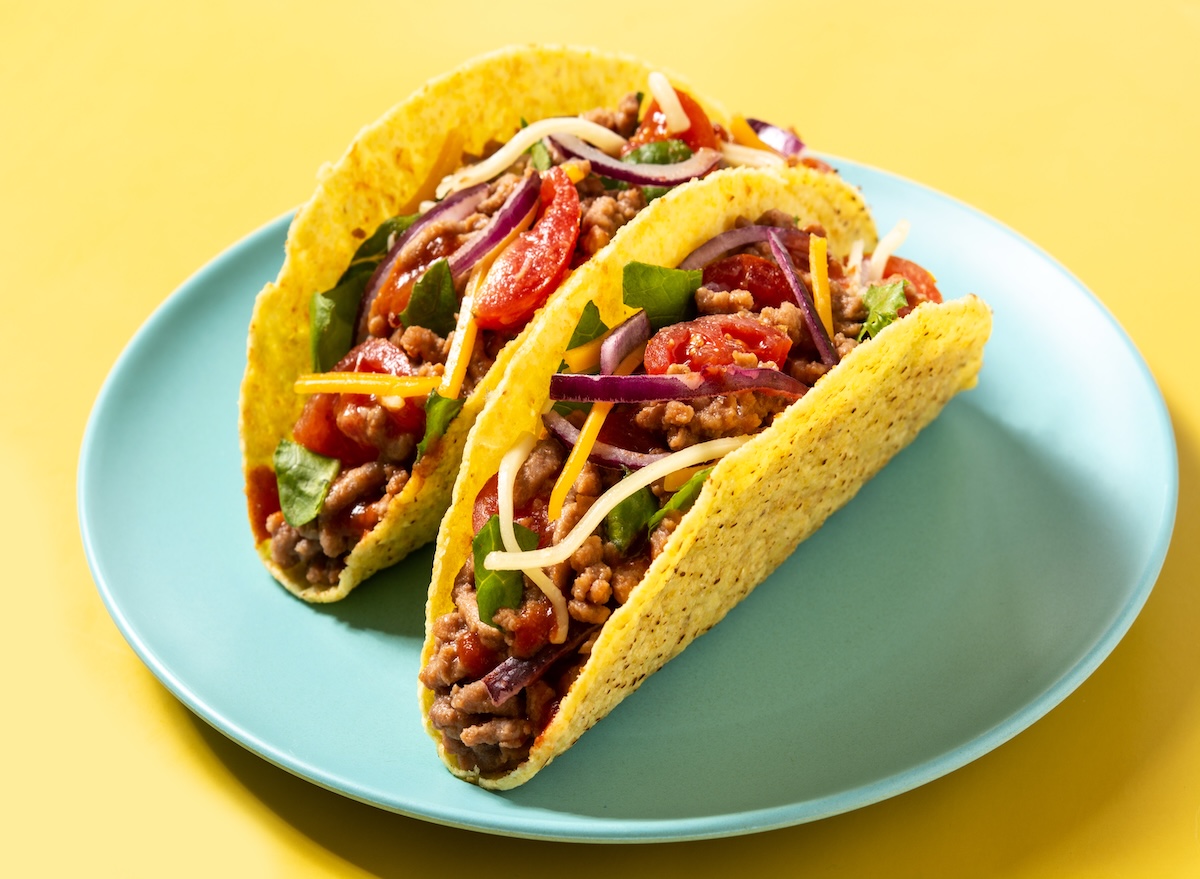 Traditional,Mexican,Tacos,With,Meat,And,Vegetables,On,Yellow,Background