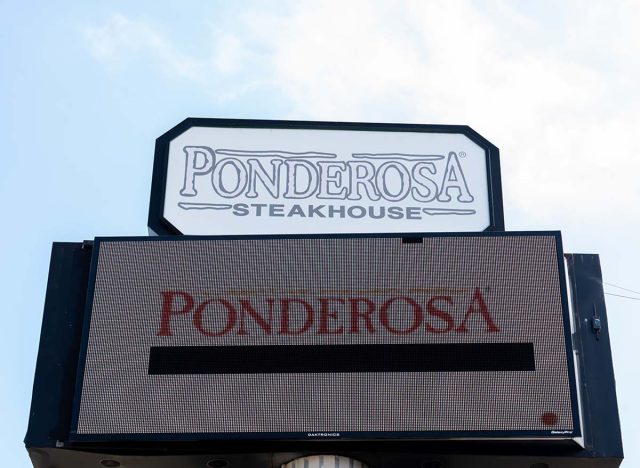 Pearland, TX, USA - February 7, 2022: A Ponderosa Steakhouse restaurant sign with blue sky in background. Ponderosa Steakhouse is a chain of buffet steakhouse restaurants.