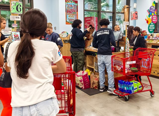 Busy scene of customers shopping and waiting in line at Trader Joe's