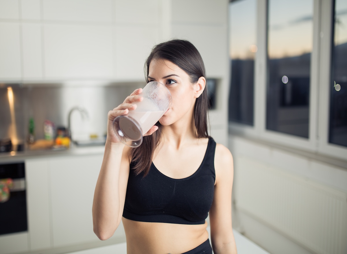 Woman,In,Sportswear,Drinking,Sweet,Banana,Chocolate,Protein,Powder,Milkshake