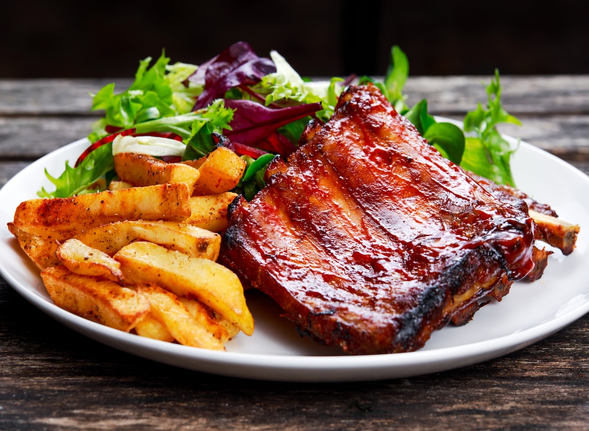 Roasted,Pork,Rib,,Fried,Potato,On,White,Plate,With,Vegetables.