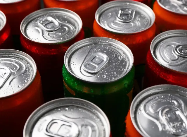 Energy drink in wet cans, closeup. Functional beverage