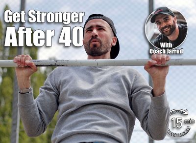 strong young man making exercises on the horizontal bar outdoor. The 6 Exercises Men Should Still Do After 40 To Stay Fit. Cover