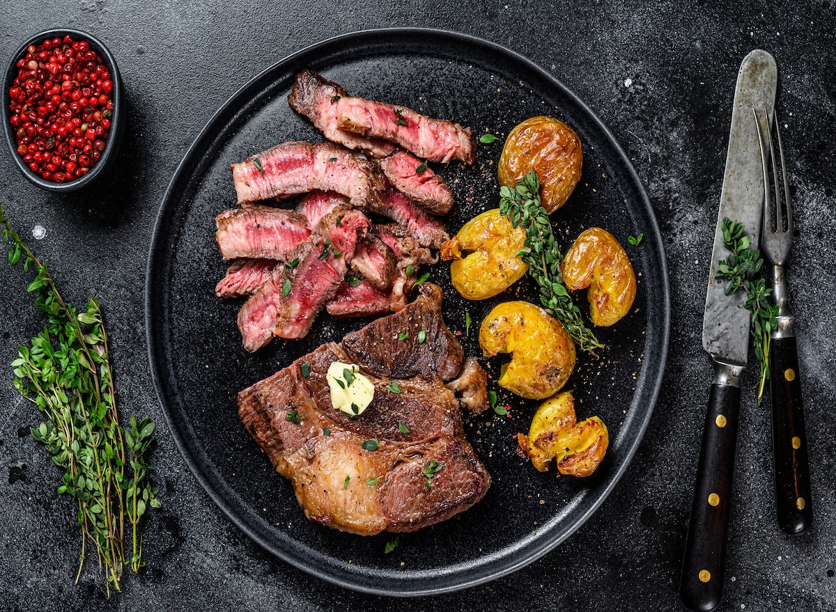 Cut,Grilled,Rib,Eye,Beef,Meat,Steak,With,Potato.,Black