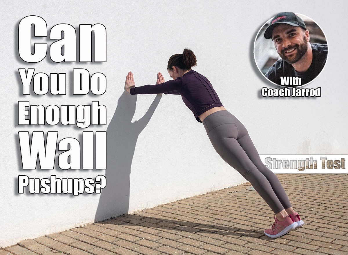 Sporty woman doing press ups against a white wall outside. Over 40? If You Can Do This Many Wall Pushups, Your Strength Is Above Average. Cover