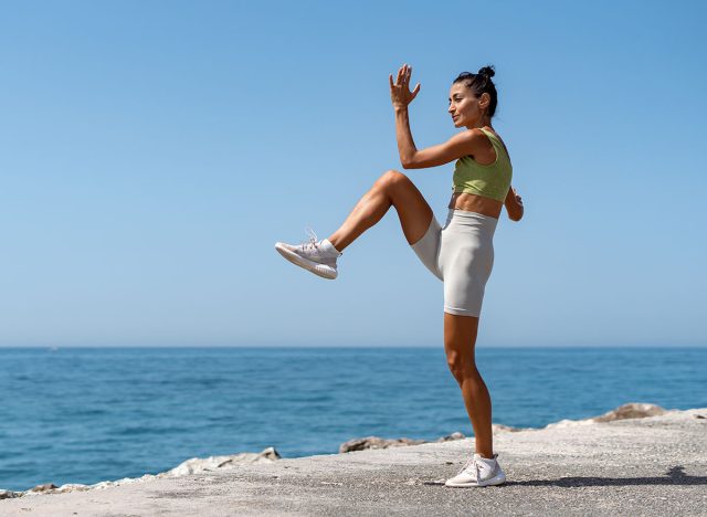 Fit Girl High Knee Exercise by the Sea