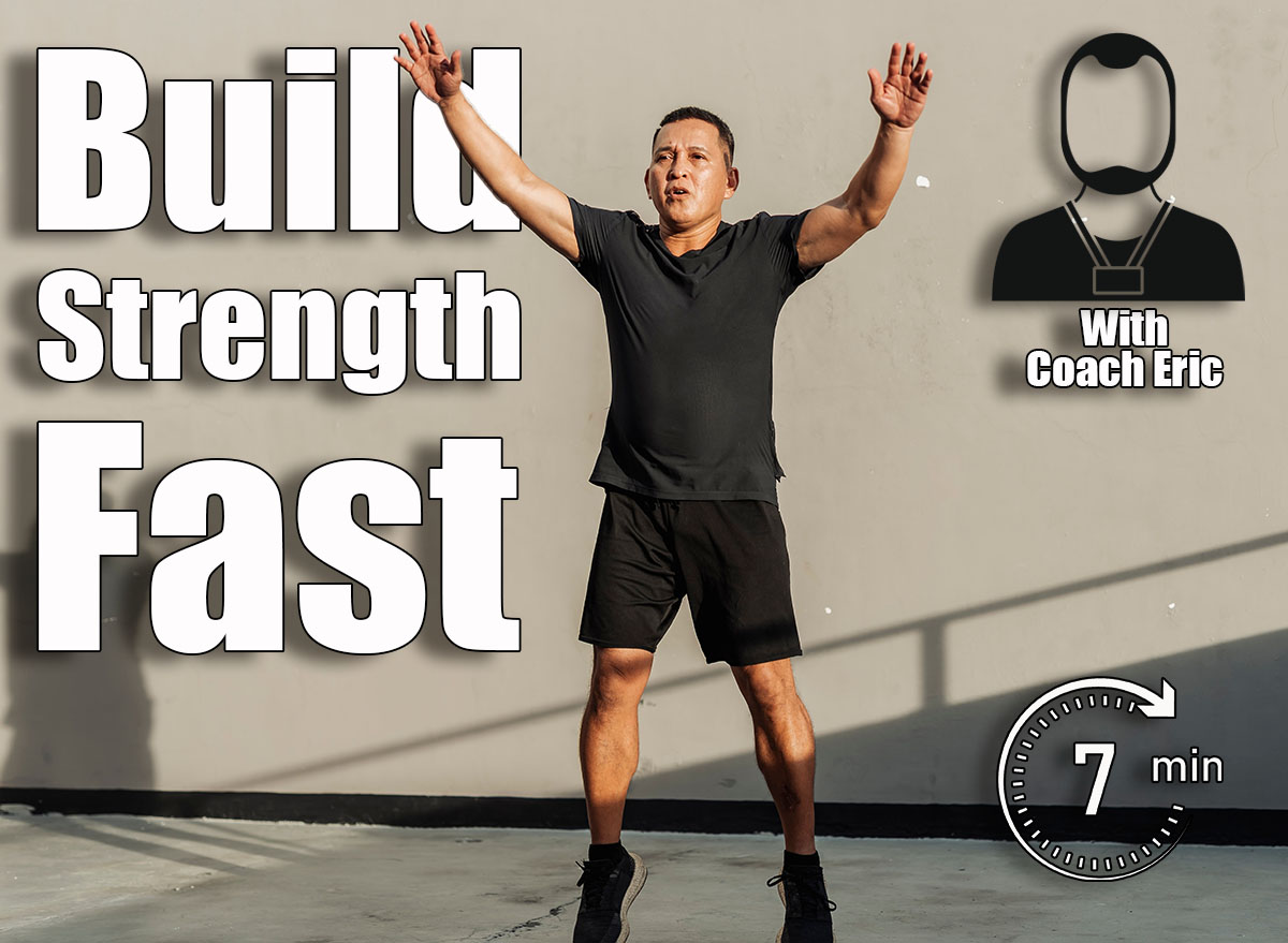 A middle-aged man performs jumping jacks outdoors against a concrete wall during a high-intensity workout session just outside the gym. Over 45? This 7-Minute Routine Builds More Strength Than Your Usual Cardio. Cover