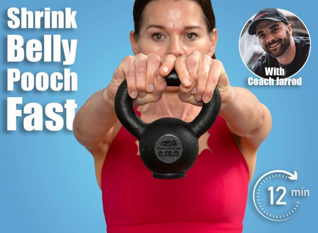 close up of a woman athlete in red sportswear lifting a kettlebell weight against blue background. 6 Standing Exercises That Shrink Belly Pooch Better Than Crunches After 40. Cover